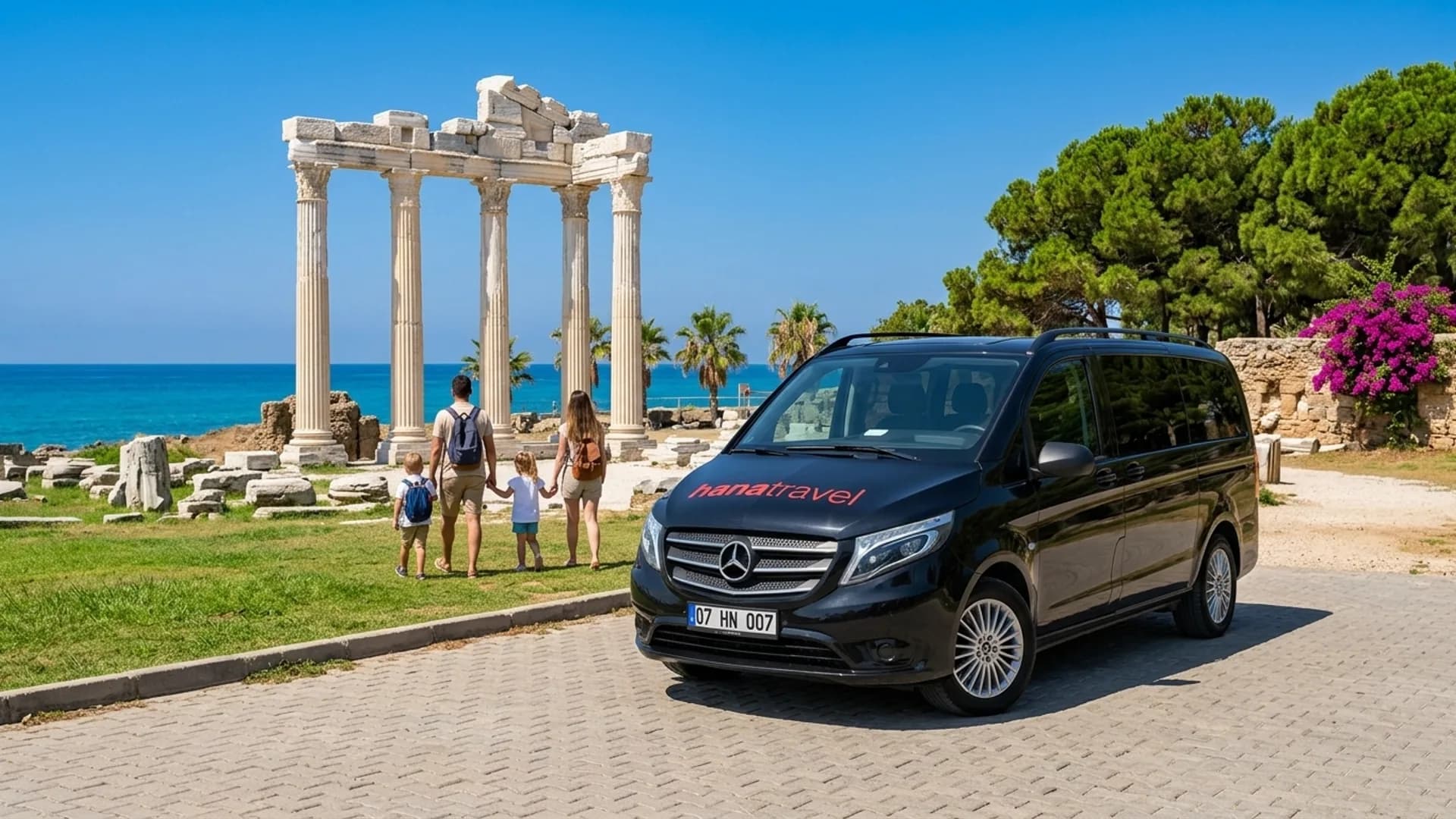 Family walking from the black Hana Travel Vito towards the marble columns of the Temple of Apollo on the Side peninsula — Side taxi transfer